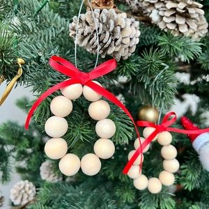 Beautiful beaded Christmas ornament with red ribbon